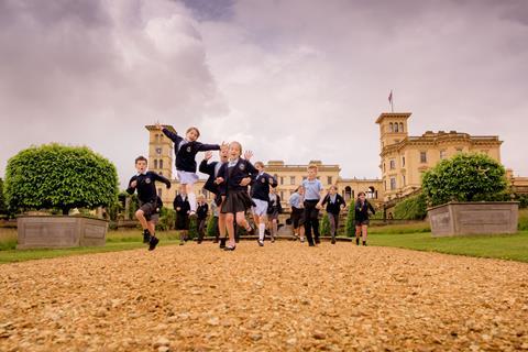 School children running around outside Osborne House on the Isle of Wight